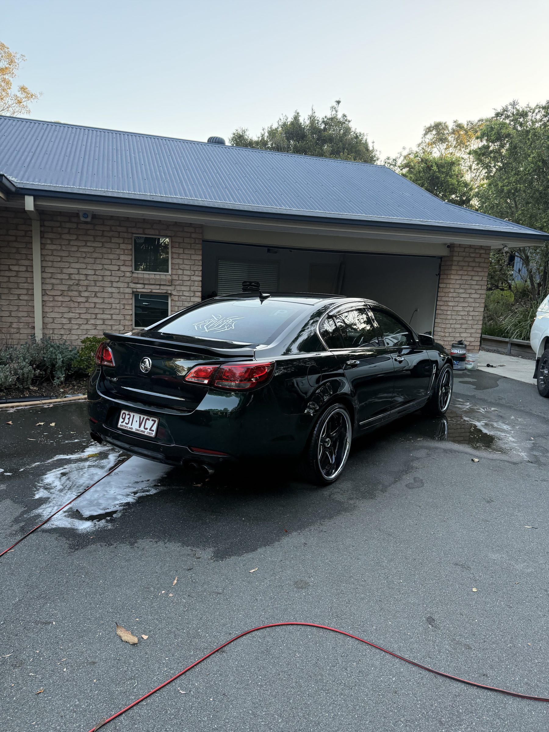 Holden Commodore being washed in South Brisbane